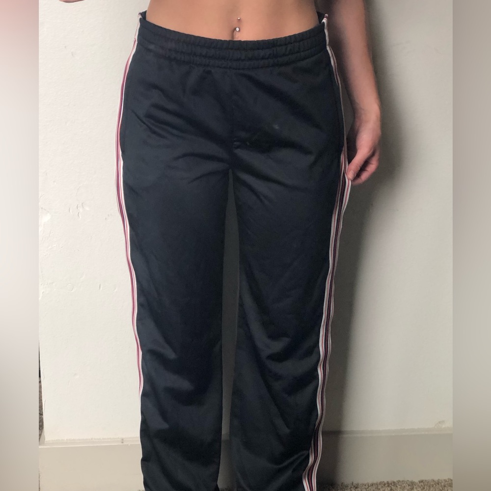 TNA track pants (white, red and navy stripes on each side)